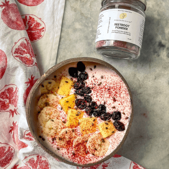 A smoothie bowl sprinkled with beetroot powder