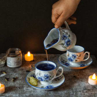 Butterfly pea flower tea pouring in a cup