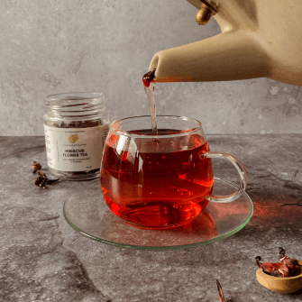 Hibiscus tea pouring in a cup