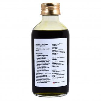Back side of a 200ml glass bottle containing hemp seed oil